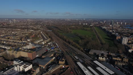 Finsbury-neighbourhood-in-London-England-by-drone,-train-station-and-park